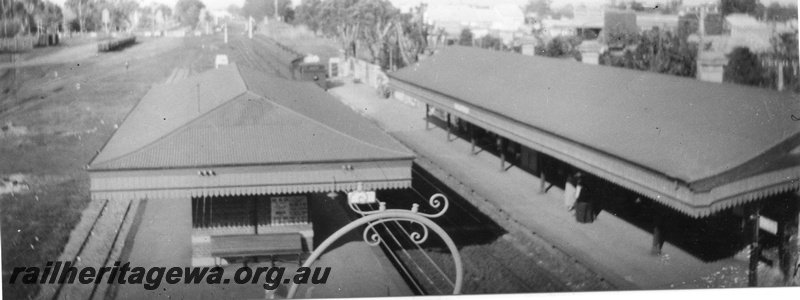 P02023
Station buildings, both main and island platform, Guildford, elevated view from the footbridge looking east, suburban train arriving, c1926
