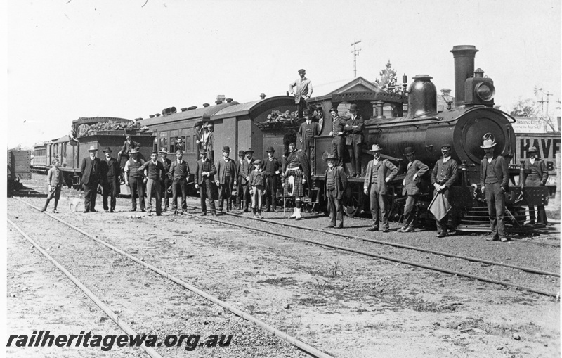 P02034
T class loco on special train, Katanning, GSR line, passengers including a kilted gentleman posing in front of train, same as P7379. c1908
