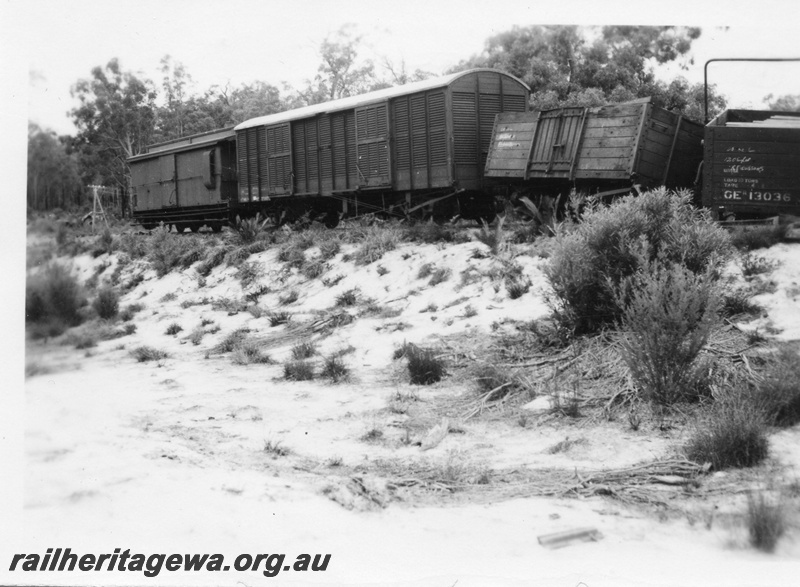 P02045
1 of 4 views of a derailment at the157-78 mile point on the Donnybrook to Katanning Railway, DK line, between Noggerup and Goonac, GER class 13036 and a GE class wagon derailed, clerestory roofed brakevan behind a VD class bogie van, see P2025-P2028, date of derailment 26/3/1955
