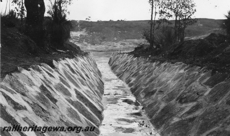 P02075
11 of 12 views of the construction of a railway dam at Hillman, BN line, looking up channel from Main Rock
