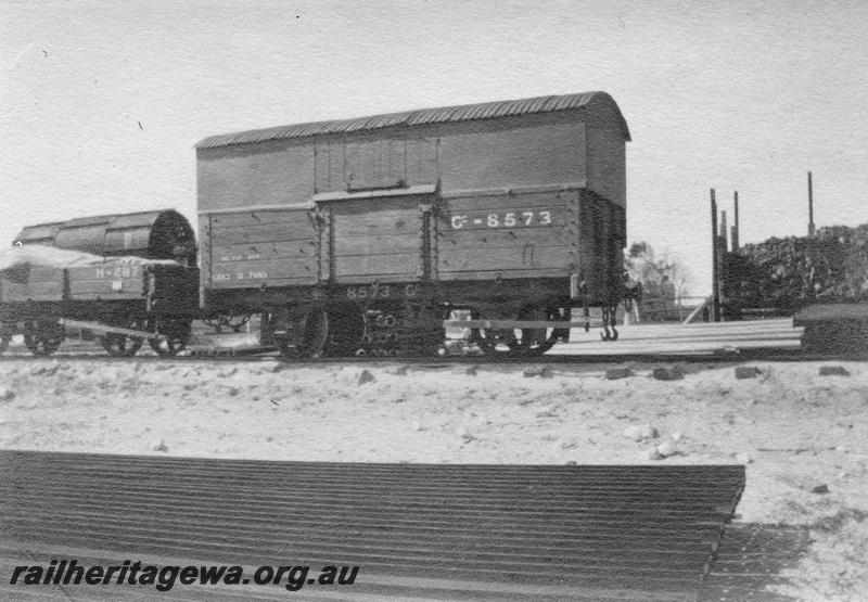 P02084
5 of 44 views of the construction of the railway at Esperance, CE line taken by Cedric Stewart, the resident WAGR engineer, H class 287, GC class 8573 with extended side and corrugated iron roof, side view 
