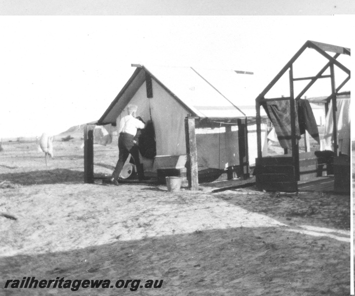 P02100
21 of 44 views of the construction of the railway at Esperance, CE line taken by Cedric Stewart, the resident WAGR engineer, worker's tents, one without covering.
