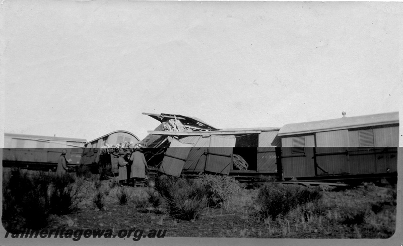 P02135
4 of 9 views of a derailment of No 26 Mixed on 26/6/1926 near Konnongorring, EM line, bogie vans including V class 3394 with diagonal planking, derailed
