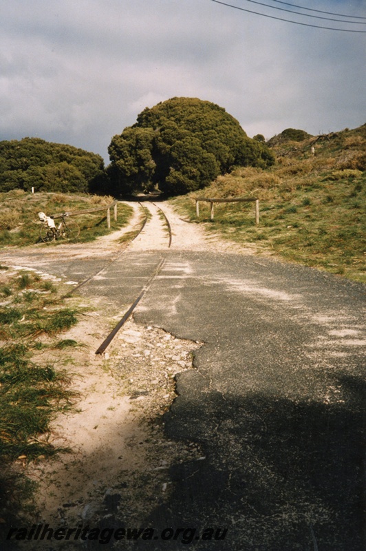 P02599
Trackwork, Rottnest Island Railway, view along the track at a level crossing.
