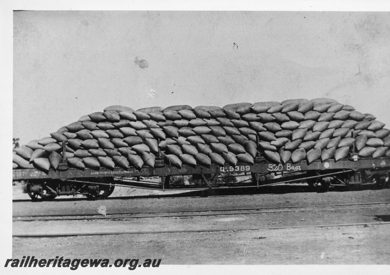 P02651
QA class 9389 flat wagon loaded with 320 bags of wheat, side view.
