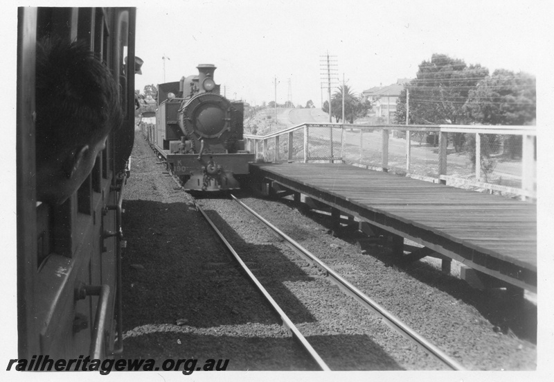 P02668
K class 190 steam locomotive goods train at Mount Lawley, front view, raised wooden platform, ER line.
