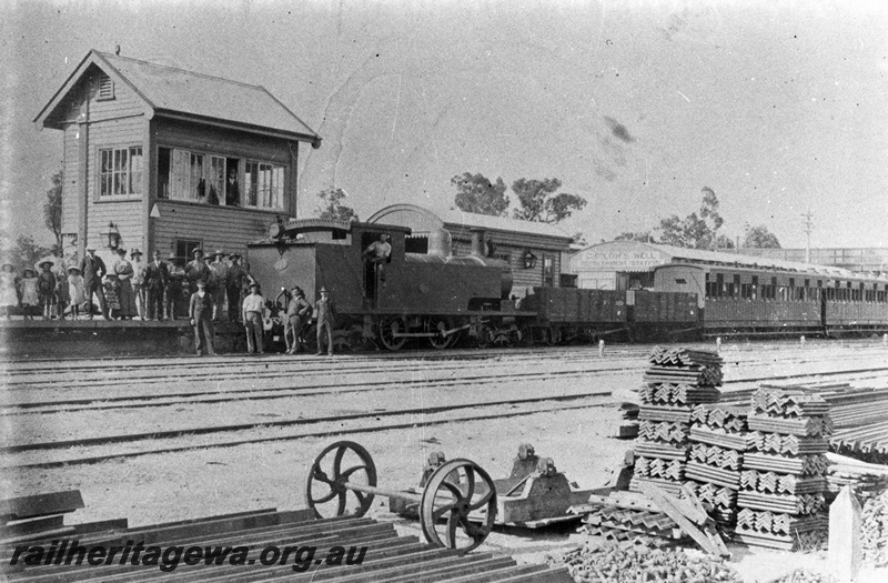 P02787
N class 261coupled to two open wagons and side loading carriages with sun shades over the windows, signal box, station building, Chidlow's Well, ER line, people standing on the platform and in front of the loco on the track, c1905, same as P4900
