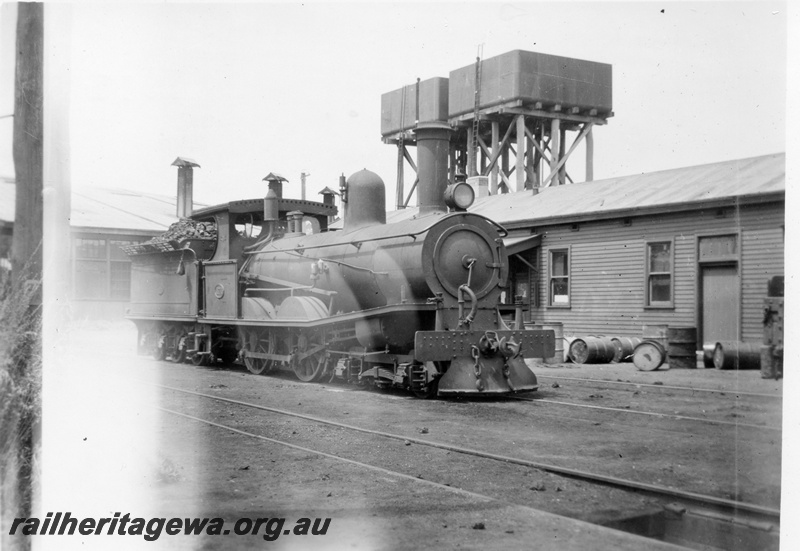 P03022
T class 171 steam locomotive, side and front view, twin water towers with 25,000 gallon cast iron tanks, Bunbury, SWR line.
