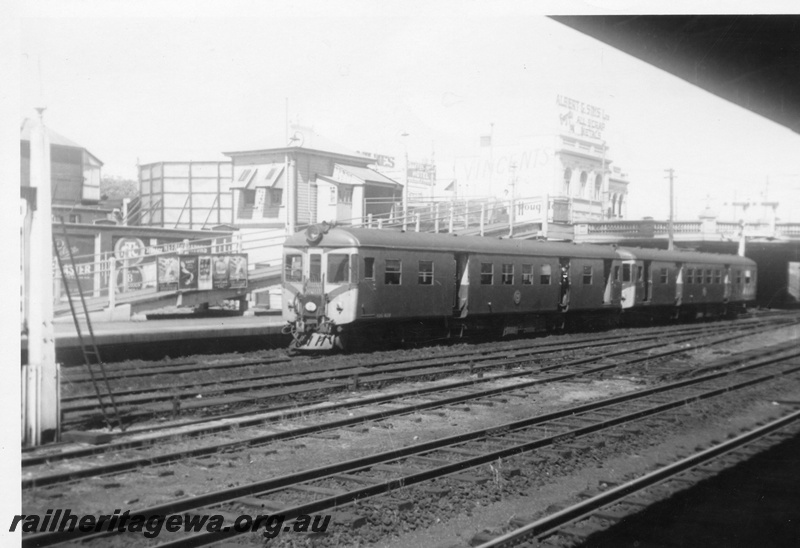 P03070
ADG class 609 and 610 diesel railcars, front and side view, footbridge, booking office, Perth, ER line.
