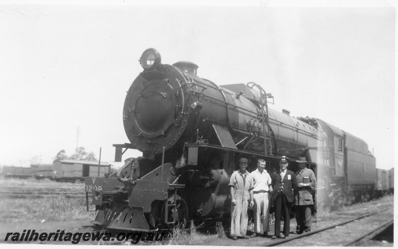 P03244
V class 1209 steam locomotive, front and side view, with crew posing alongside, Midland Junction, ER line.
