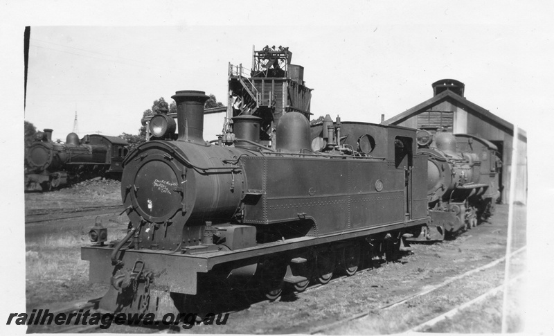 P03397
K class 87 steam locomotive, front and side view, coal stage, loco sheds, Collie, BN line.
