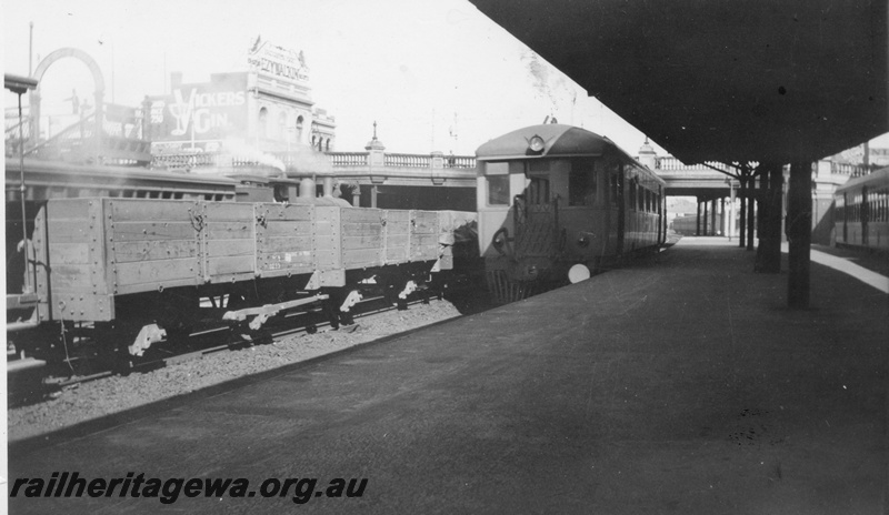 P03402
ASA class 445 Sentinel steam railcar, end and side view, GB class open wagons, passenger platform, Perth station, ER line.

