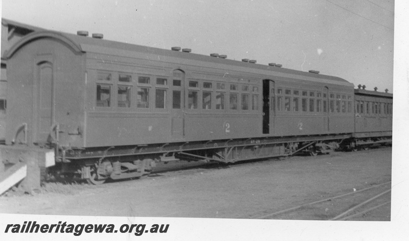 P03448
AY class 28 second class suburban saloon carriage, end and side view, buffer stop, c1930s.

