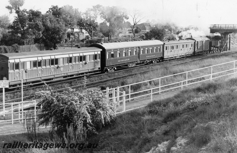 P03450
J class 6 ex MRWA carriage, JV class 32 ex MRWA corridor sleeping carriage, side view, on a train at Success Hill, ER line, c1964. 
