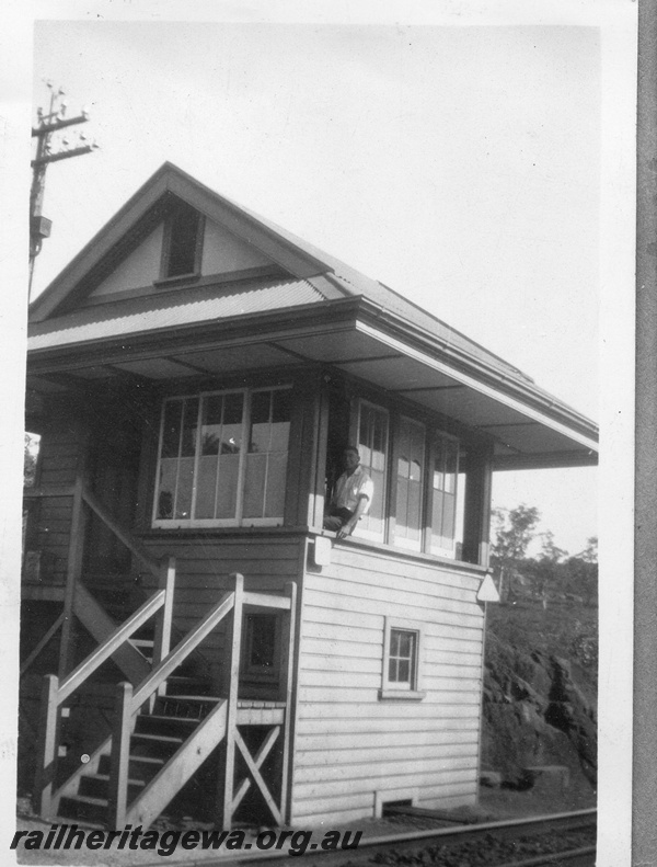 P03451
Signal box, Tunnel Junction, just east of the Swan View tunnel, ER line, view from trackside, signalman A.E. Risley leaning out of window
