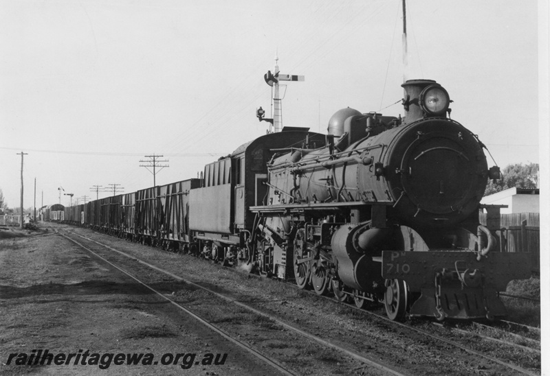 P03576
PM class 710, signal, train of XA class coal hoppers, arriving at Bunbury, SWR line, view along the train
