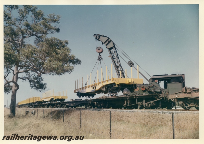 P03723
Cravens 25 ton breakdown crane No 23, lifting WSP flat top wagon onto breakdown train
