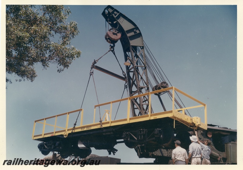 P03725
 Cravens 25 ton breakdown crane No 23, lifting WSP flat top wagon, side view
