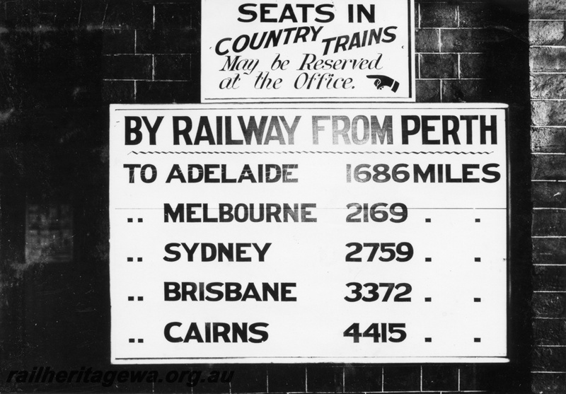 P04085
Mileage board showing distances of capital cities from Perth, Perth Station, also a notice advising that seats on country trains could be reserved at the office 
