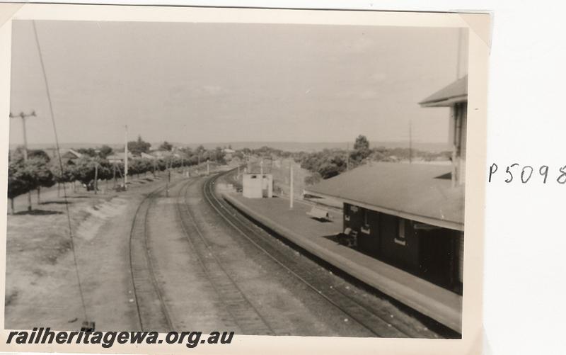 P05098
Station yard, Bassendean, showing part of the elevated signal box, elevated view looking east.
