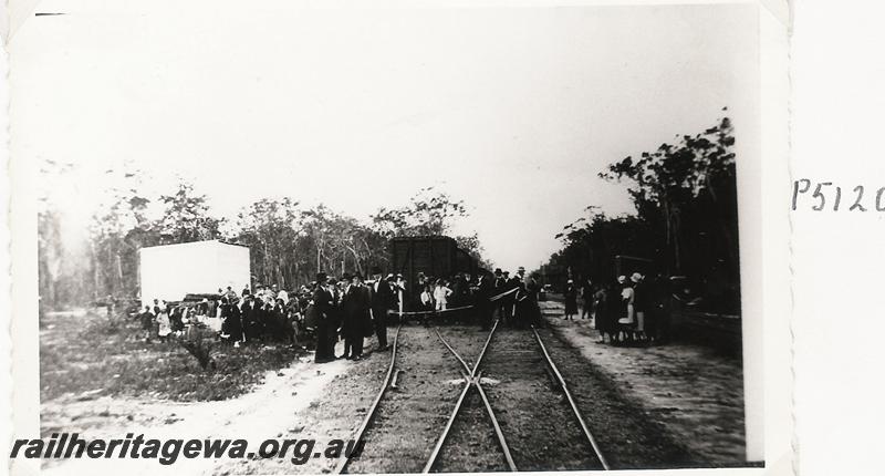 P05120
Ceremony for the first train to Margaret River, BB line, crowd with a streamer across the line
