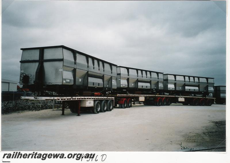 P05160
Iron ore wagons, Bassendean, loaded onto road trailers ready for transportation to the Pilbara

