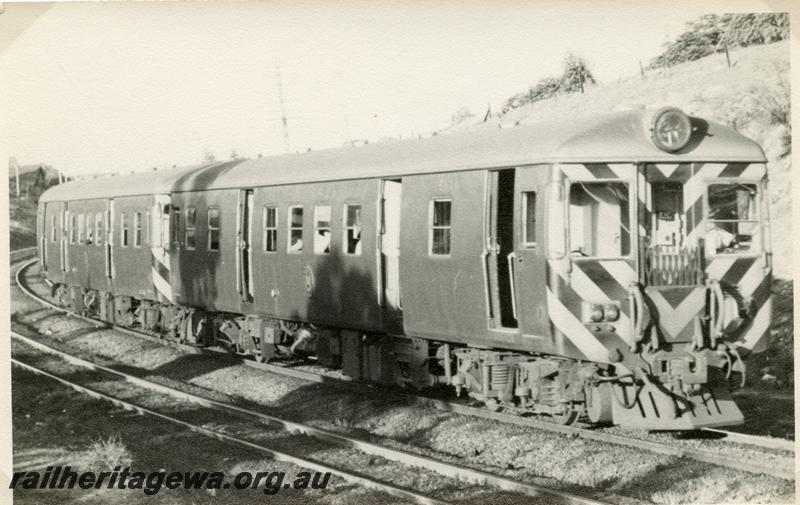 P05848
A pair of ADG class railcars in the original livery of plain green with black and gold chevrons on the ends, approaching Mount Lawley, side and front view

