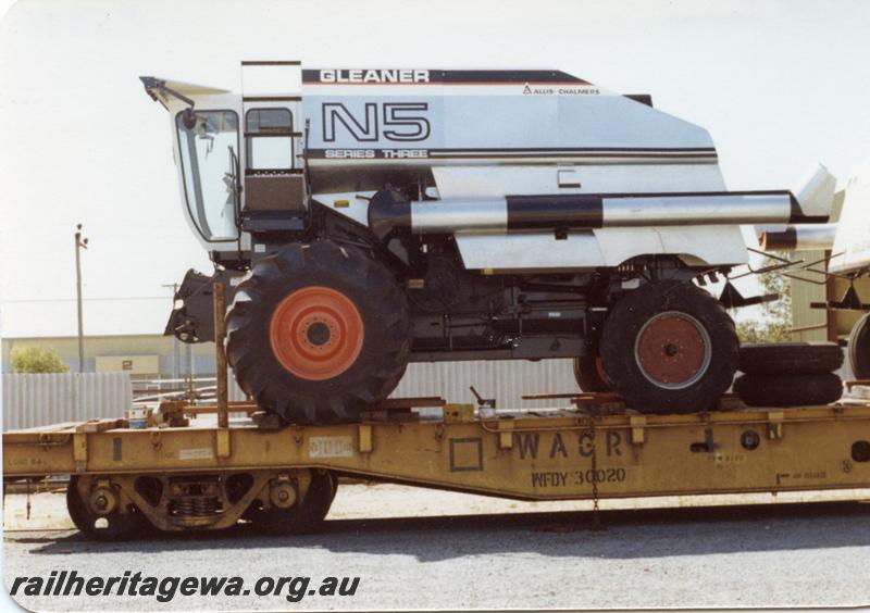P05886
WFDY class 30020 flat wagon, (reclassified from a WF class), loaded with a harvester
