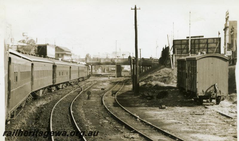P06233
Country passenger train entering Perth Station, view from east side of Barrack Street Bridge, end view of A class horse boxes in siding

