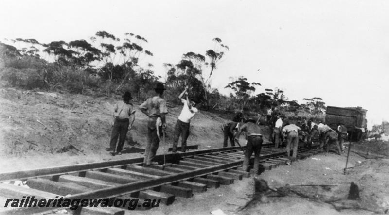 P06734
Track construction, gangers hammering in dog spikes
