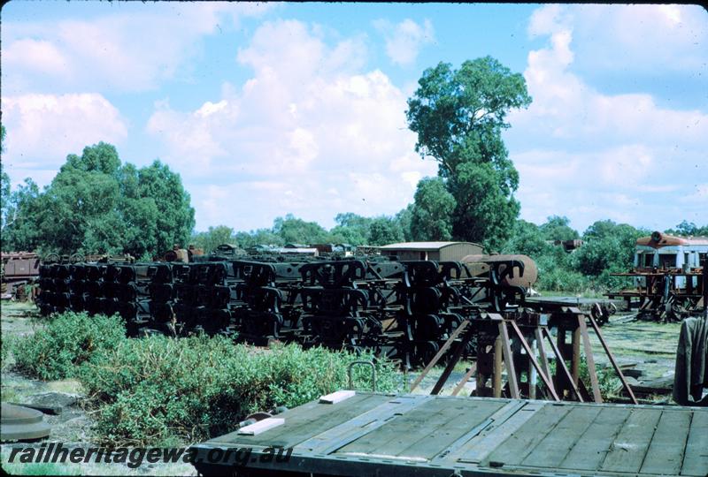P06867
Stack of bogies and end of ADE class at Salvage yard, Midland Workshops.
