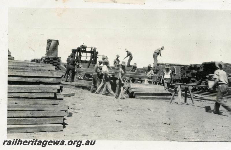 P07012
1 of 7 photos of the construction of the Cue - Big Bell railway, NR line, shows the adzing and boring gang
