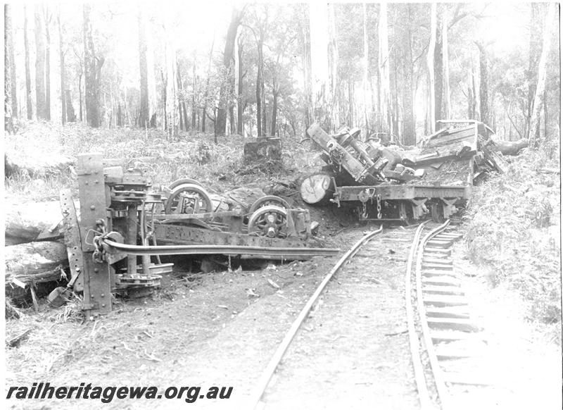 P07099
2 of 5 views of the derailment of SSM loco No.57, Deanmill, view along track showing derailed and overturned wagons
