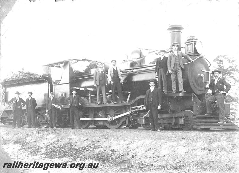 P07181
MRWA B class 7, well dressed men posing on the loco, side and front view.
