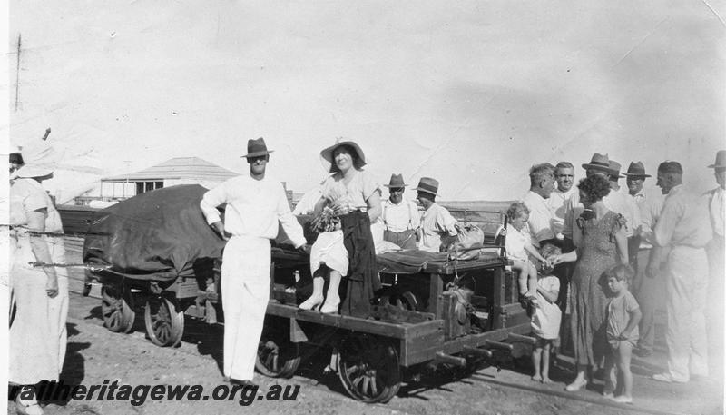 P07471
Motorised trolley and trailer, Port Hedland to Marble Bar line, PM line, Mr and Mrs J. Hocking and family en route to Marble Bar, 11CWT of goods and luggage, eight passengers and driver
