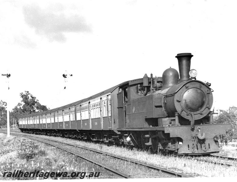 P07500
N class, 4-4-4T steam loco hauling a suburban set comprising an AYB class, three AY class carriages and another AYB class, approaching Daglish, signals,  view along the train, ER line.
