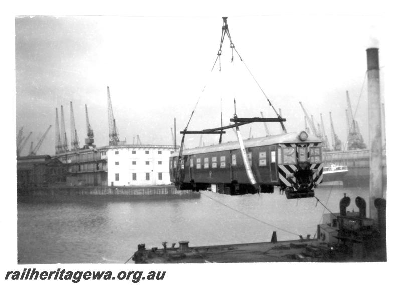 P07745
4 of 4 views of ADG class railcar on docks at Liverpool, UK being loaded on to ship
