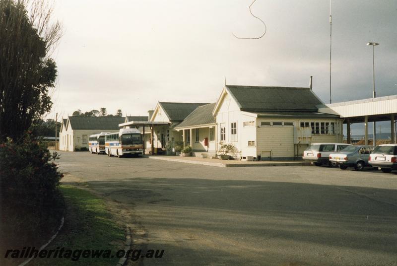 P08533
Albany, station building, sheds, view from road side, 2 road buses, GSR line.
