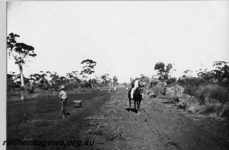 P08895
11 of 29 views of the construction of the Wyalkatchem-Lake Brown-Southern Cross railway, WLB line. Man on horseback conversing with a worker on the trackbed
