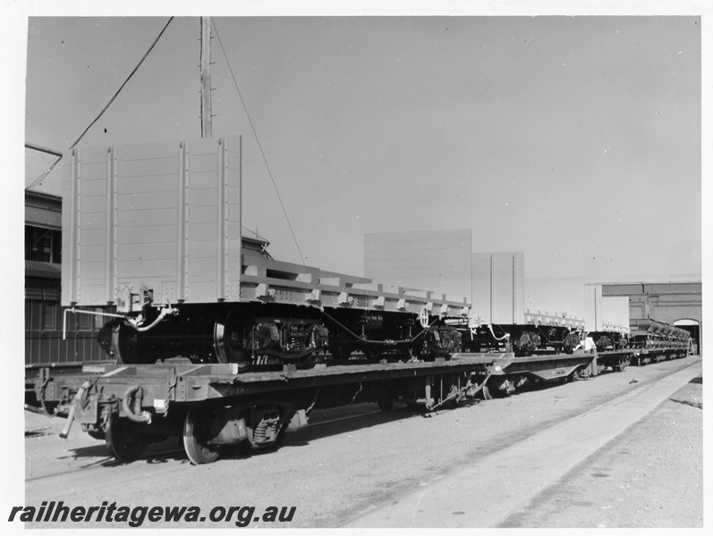 P10247
WSF class standard gauge flat wagons with end bulkheads loaded onto narrow gauge flat wagons, Midland Workshops, view along the wagons
