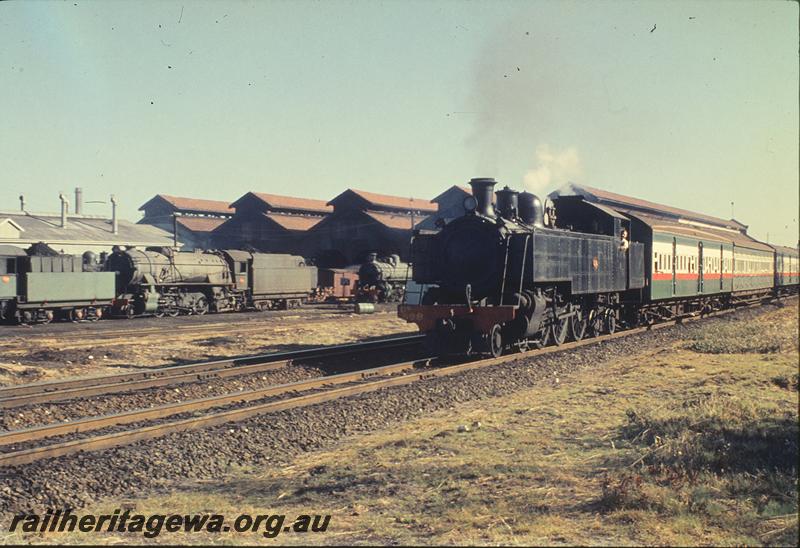 P11870
DD class 598, down suburban passenger, East Perth loco shed in background. ER line.

