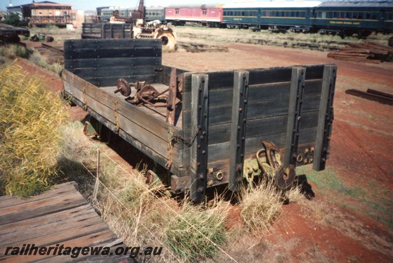 P12576
Jetty wagon, two plank sides and high bulkheads, Pilbara Railway Historical Society museum, Dampier, end and side view
