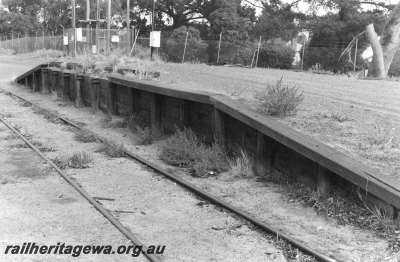 P12600
Loading platform, Armadale, SWR line, overgrown and out of use, trackside and end view.
