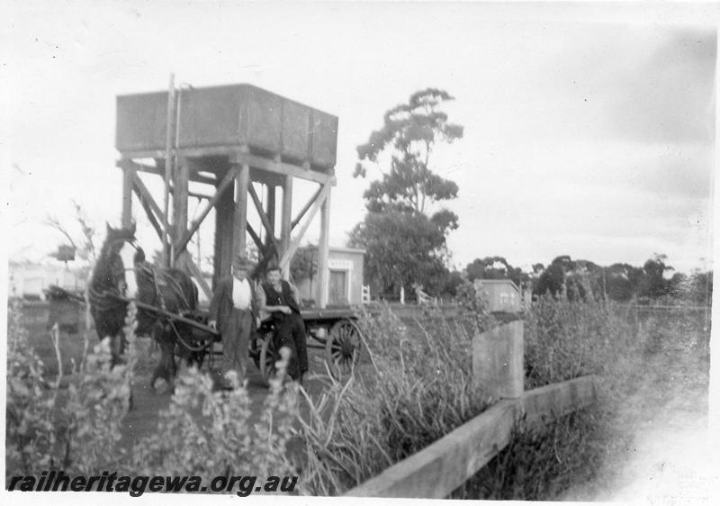 P12637
Water tower, Moora, MR line, Bill Medbury and Des Murray, Carriers with hose and cart in front of tower, 
