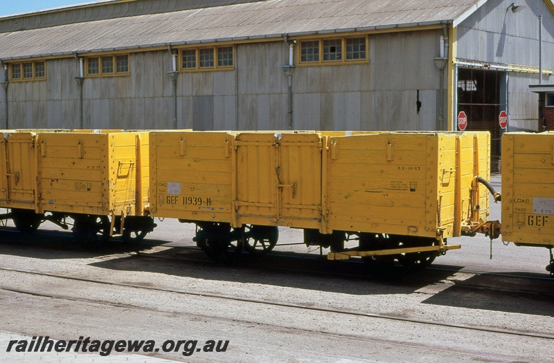 P15644
GEF class 11939 sandwiched between two other GEF class wagons, in the all over Westrail yellow livery, Geraldton yard, NR line, side and end view.
