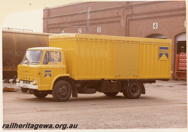 P15988
Westrail Ford truck, licence no UOR032, in yellow and blue colour scheme, Midland Workshops, front and side view
