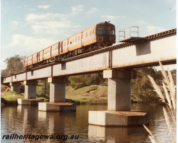 P16340
ADG class railcar set, on concrete and steel bridge, crossing Swan River, Guildford, ER line, side and end view
