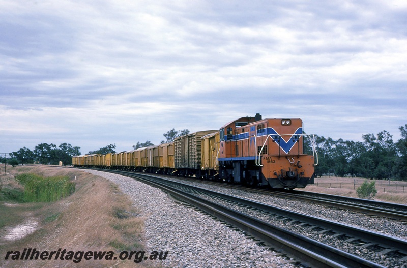 P16720
Westrail MA class 1863, Westrail orange livery, Beckenham, Forrestfield - Cockburn Junction line, goods train, beer loaded in louvre vans at Swan Brewery, Canning Vale.
