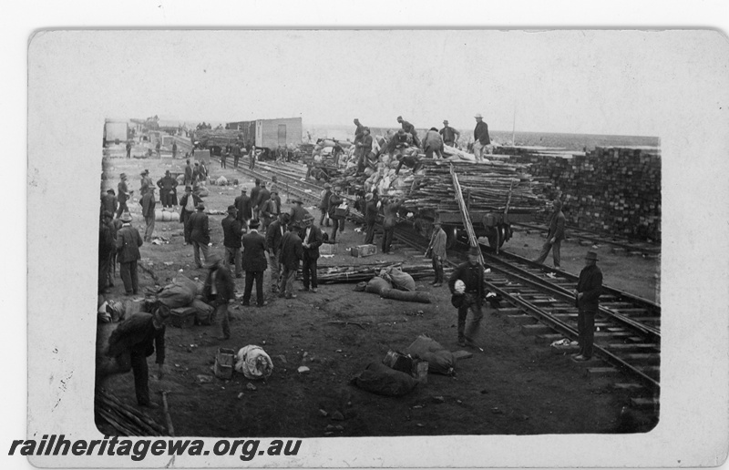 P16800
Commonwealth Railways (CR) - TAR line unloading material at an Unknown construction camp. c1916
