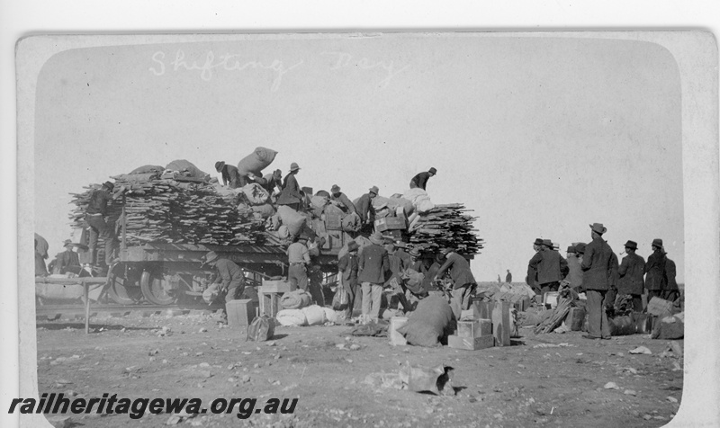 P16817
Commonwealth Railways (CR) - TAR line track workers unloading materials from flat wagon at an Unknown location. c1916
